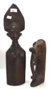 Two African carvings, one a bust of a woman, the other an elephant,