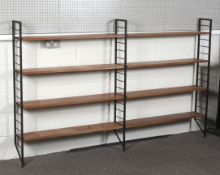 Two Staples Ladderax open bookcase sections, with three black metal uprights, L215cm x D20.