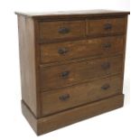 An early 20th century oak chest of two short over three long drawers, with metal handles,