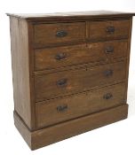 An early 20th century oak chest of two short over three long drawers, with metal handles,