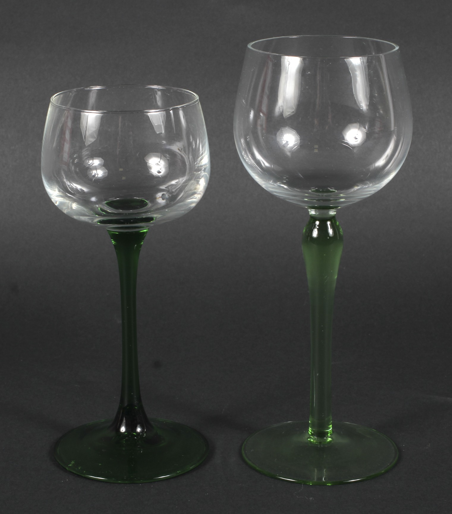 Two sets of six green stemmed glasses, on circular bases 18.5cm & 16. - Image 2 of 2