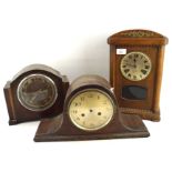 Three early 20th century wooden mantle clocks, with two having Arabic numerals denoting hours,