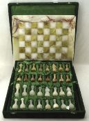 An onyx chess set, including a board and a complete set of pieces,