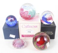 Three boxed Caithness paperweights and two others, of assorted sizes and colours,