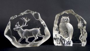 Two glass models one carved with an owl and the other a stag, signature to bases,