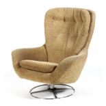 A Mid 20th century upholstered swivel armchair, on a chrome circular metal base,