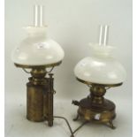 Two adapted brass electrified oil lamps, each with outer white glass shade and clear funnel,