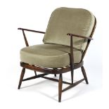 An Ercol spindleback elbow chair with removable cusions and replacement straps,