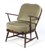 An Ercol spindleback elbow chair with removable cusions and replacement straps,