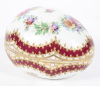 A 20th century Dresden porcelain box in the form of an egg,
