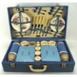 A Brexton cased picnic set, with a plastic handle and fitted interior,