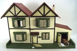 A vintage mock Tudor style doll's house named 'The Chesnuts', mid-century,