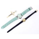 Two ladies wristwatches and a late 19th/early 20th century cross,