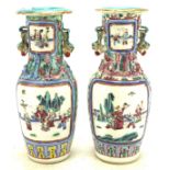 A pair of Cantonese porcelain vases, painted with figures before terracing, early 20th century,