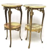 A pair of marble topped stands, the cast metal base with cabriole supports,