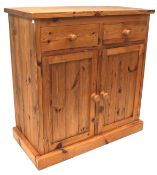 A pine kitchern cupboard, with two short drawers above two panelled doors, enclosing a shelf, L86.