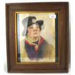 A pastel portrait of a lady, circa 1930, wearing a black hat, indistinctly signed lower right,