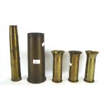 A collection of military shell cases, of varying sizes, three smaller stamped 1952/52/55, 40MM MK4,