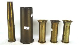 A collection of military shell cases, of varying sizes, three smaller stamped 1952/52/55, 40MM MK4,