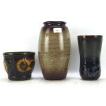 Three ceramic vases, one West German model number 887-14 13cm high,