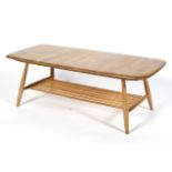 An Ercol blonde elm coffee table, with spindle rack undertier,