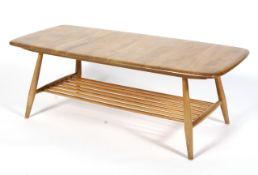 An Ercol blonde elm coffee table, with spindle rack undertier,