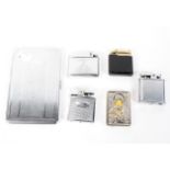 An assortment of vintage cigarette lighters and an early 20th century cigarette case,