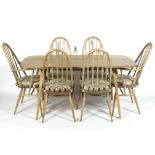 An Ercol blonde elm dining room suite,