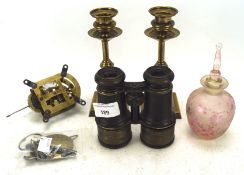 A group of assorted collectables, including a pair of brass candlesticks,