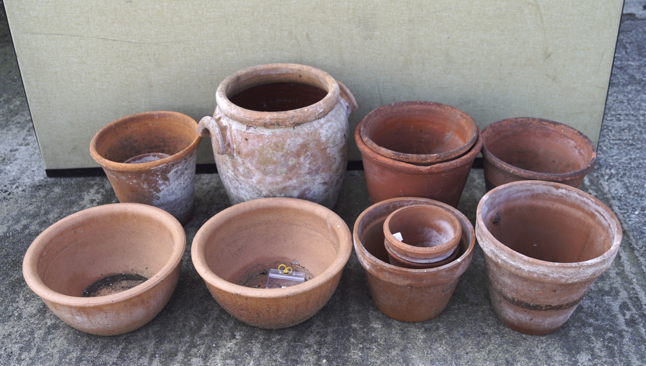 A collection of terracotta garden pots and planters,