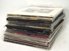 An assortment of 1980's and 1970's vinyl records, including Kate Bush, Liam Gallagher ect,