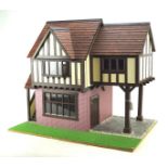 A 20th century dolls house, in the Tudor Style,