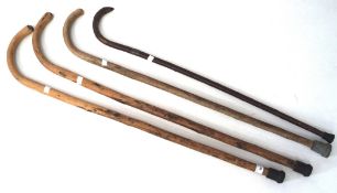Four vintage walking sticks,