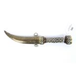 A Middle Eastern style knife, with engraved steel blade,