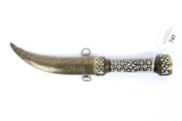 A Middle Eastern style knife, with engraved steel blade,