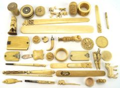 An assortment of ivory items, including a letter openers, a tortoiseshell box with ivory inlay,
