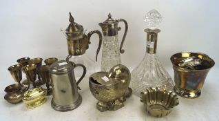 An assortment of silver plate and metal ware, including two decanters, one claret jug,