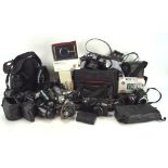 Large collection of vintage cameras and related equipment, including: an Olympus Camedia E-20p 5.