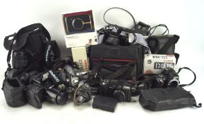 Large collection of vintage cameras and related equipment, including: an Olympus Camedia E-20p 5.