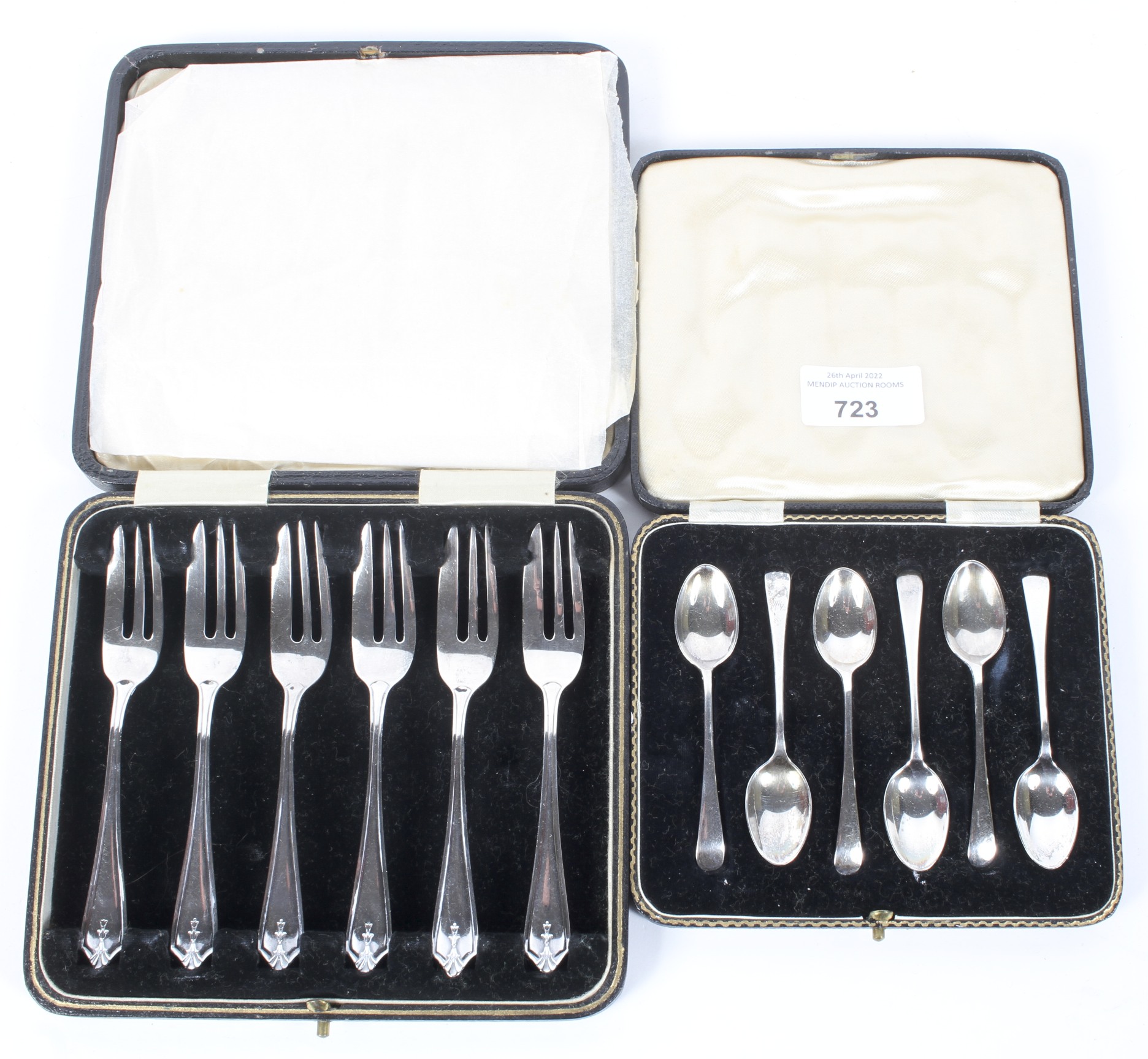 A set of six silver cake forks and a set of six silver spoons,