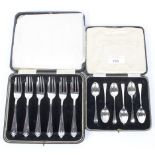 A set of six silver cake forks and a set of six silver spoons,