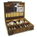 An early 20th century oak cased canteen of silver plated cutlery (Sheffiled Co.