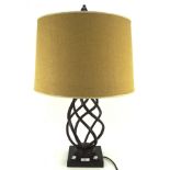 A contemporary table lamp, the metal frame modelled with a spiral effect on a square base,