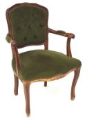 A Louis VX style elbow chair, with a carved mahogany frame,