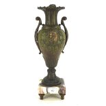 An early 20th Century Continental patinated bronze vase with cast leaf scroll handles and Bacchus