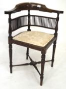 An Edwardian bone inlaid mahogany corner chair, on tapered supports, upholstered in cream fabric,