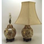 Two Asian table lamps, possibly Japanese each with floral decoration on a cream ground,