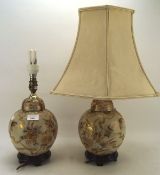 Two Asian table lamps, possibly Japanese each with floral decoration on a cream ground,