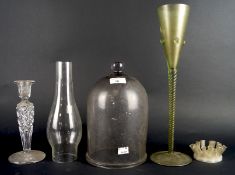 A collection of glassware including a goblet, cut glass candlestick, a glass dome ect,