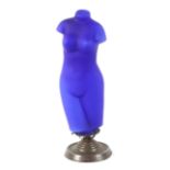 A Continental blue glass lamp in the form of a naked female torso,